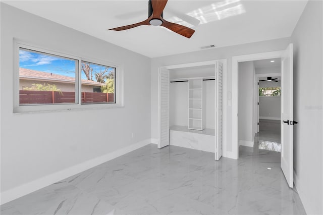 unfurnished bedroom featuring a closet and ceiling fan