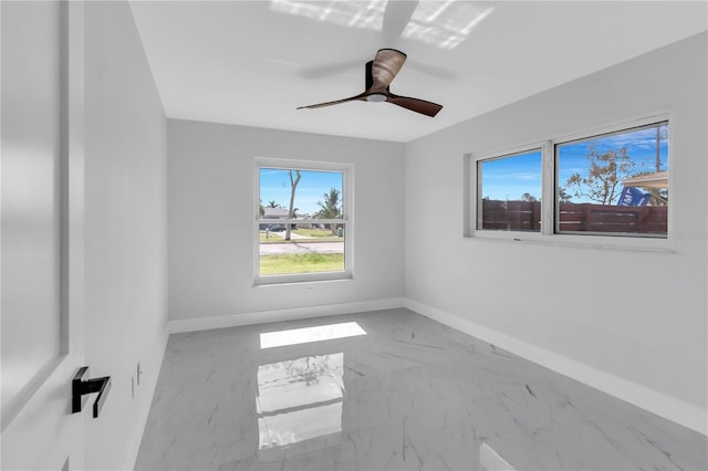 spare room with ceiling fan