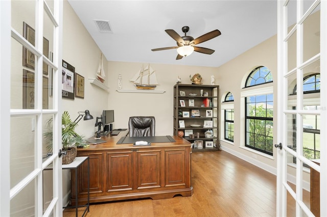 office with french doors, light wood-type flooring, and ceiling fan