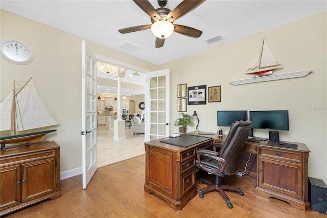 office space featuring ceiling fan, light hardwood / wood-style flooring, and french doors