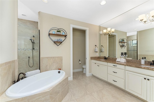 full bathroom with shower with separate bathtub, a chandelier, toilet, and vanity