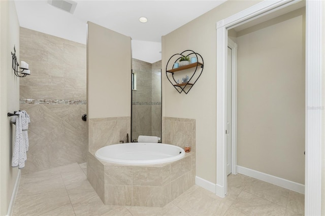 bathroom with independent shower and bath and tile patterned flooring