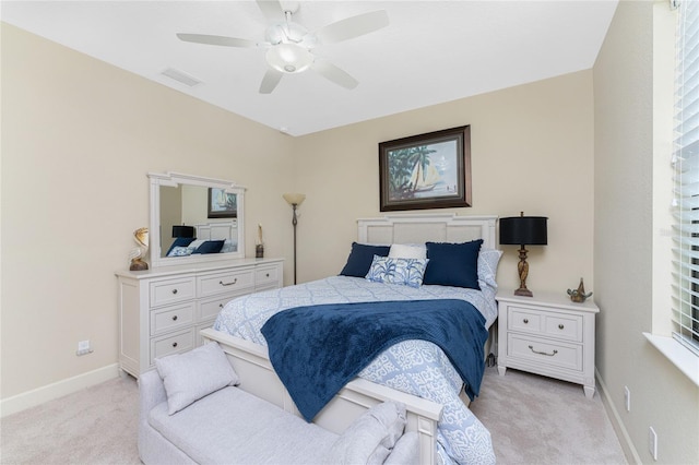 bedroom with light carpet and ceiling fan