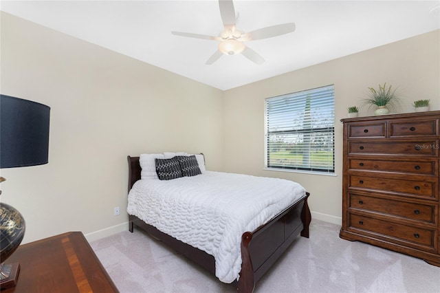 bedroom with light colored carpet and ceiling fan