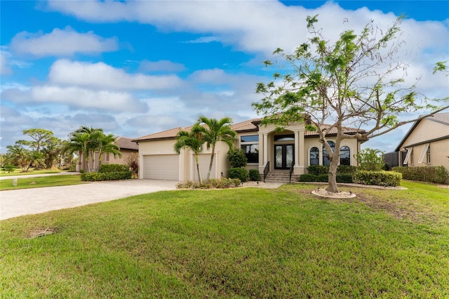 mediterranean / spanish-style home with a garage and a front yard