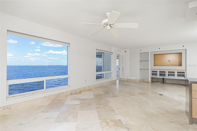 1 Colony Point Dr Unit 16B, Punta Gorda, FL 33950 - unfurnished living room with a water view, a ceiling fan, and built in features