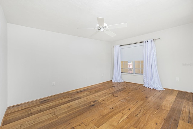 unfurnished room featuring wood-type flooring and ceiling fan