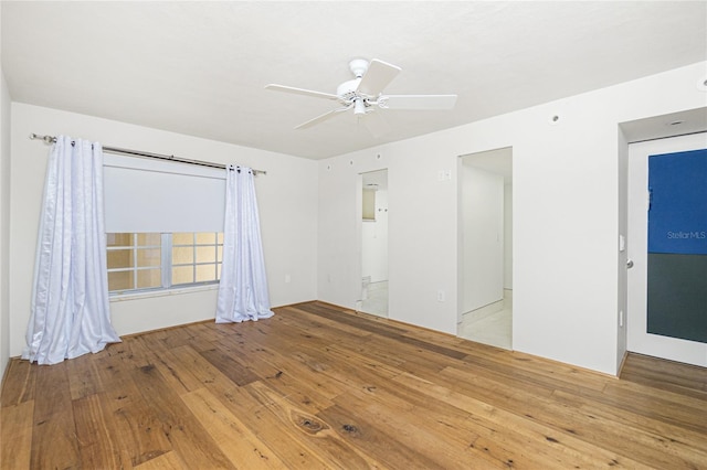 1 Colony Point Dr Unit 16B, Punta Gorda, FL 33950 - spare room featuring wood finished floors and ceiling fan