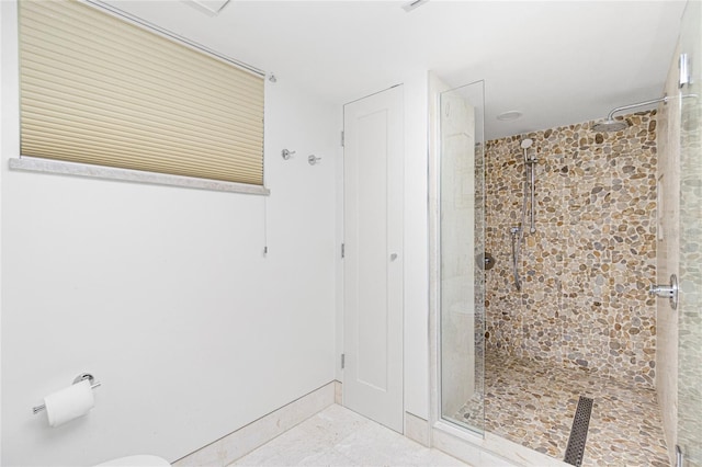 1 Colony Point Dr Unit 16B, Punta Gorda, FL 33950 - bathroom featuring a stall shower and baseboards