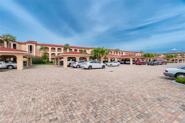 view of vehicle parking featuring a carport