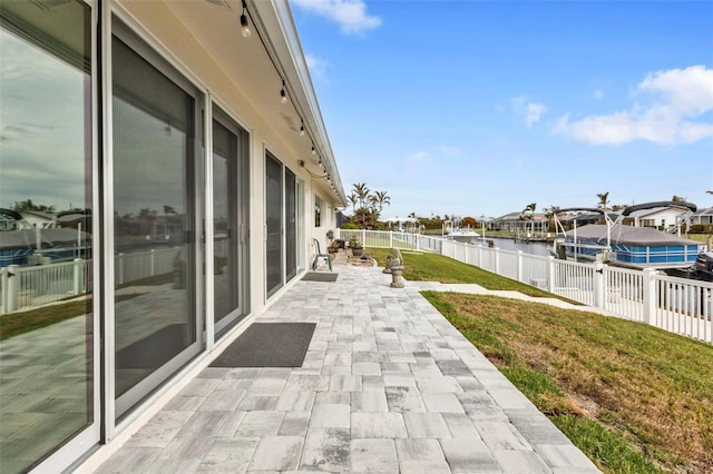 view of patio with a water view