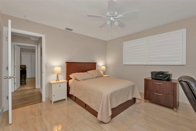 bedroom featuring light hardwood / wood-style floors and ceiling fan