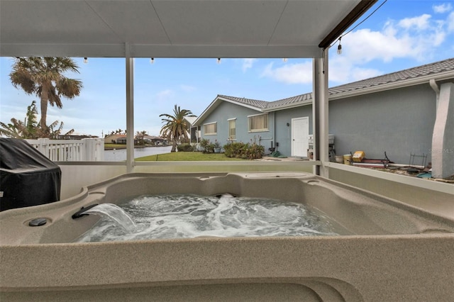 exterior space featuring a jacuzzi