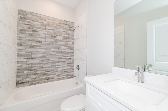 full bathroom with toilet, tiled shower / bath combo, and vanity