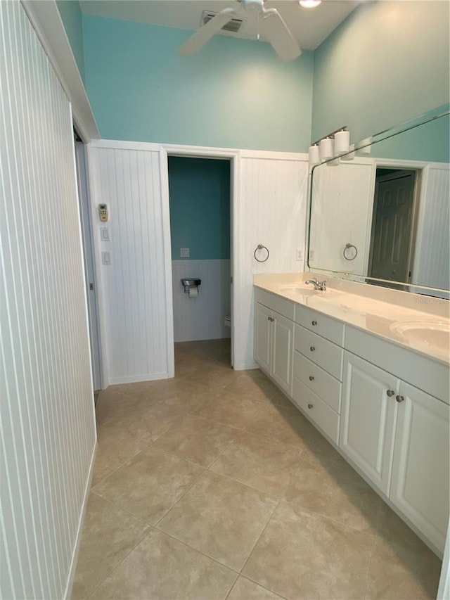 bathroom featuring ceiling fan, tile patterned flooring, vanity, and toilet