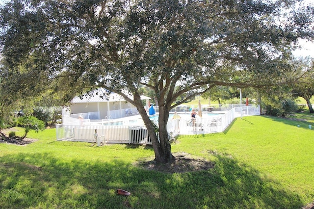 view of yard with a community pool