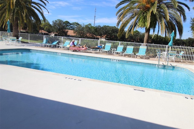 view of swimming pool featuring a patio