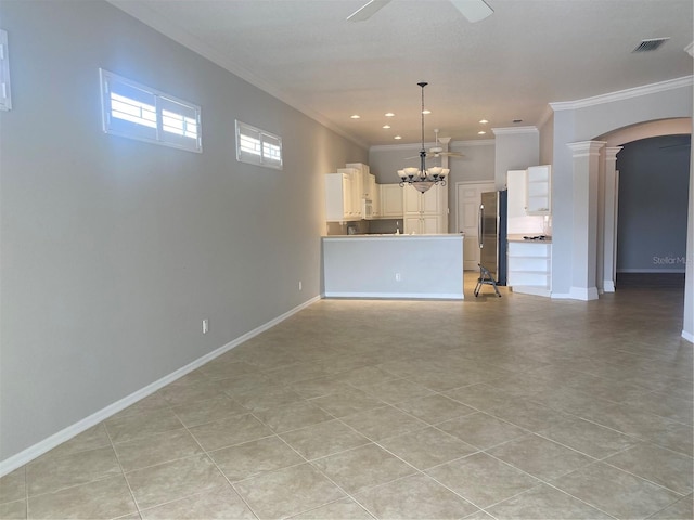 unfurnished living room featuring light tile patterned floors, ceiling fan with notable chandelier, and ornamental molding