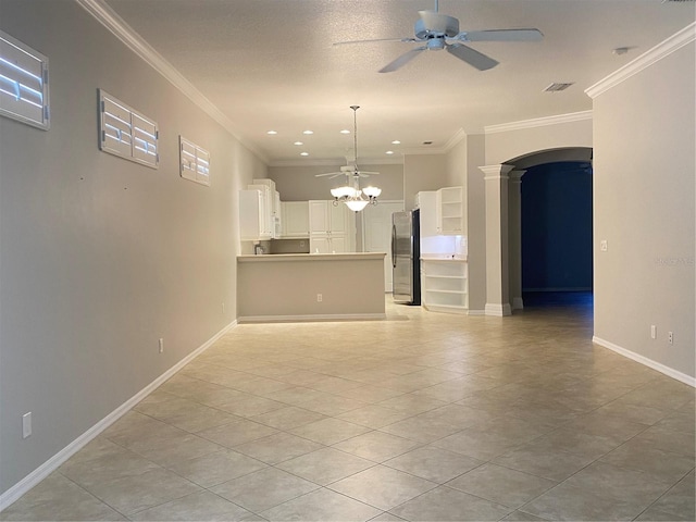 unfurnished living room featuring ceiling fan, a textured ceiling, and ornamental molding