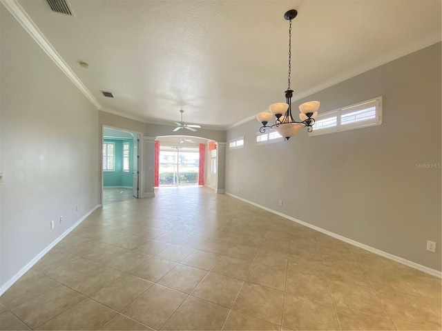 tiled empty room with a textured ceiling, crown molding, and ceiling fan with notable chandelier