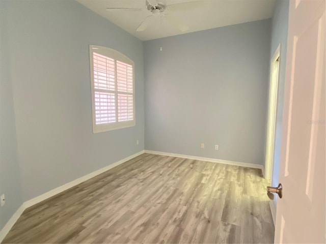 unfurnished room with light hardwood / wood-style flooring and ceiling fan