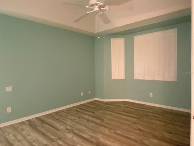 spare room featuring hardwood / wood-style flooring and ceiling fan