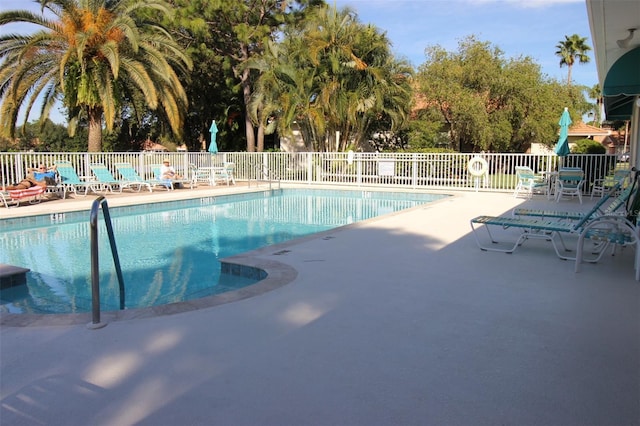 view of swimming pool with a patio