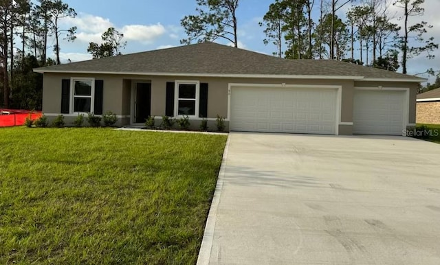 ranch-style home featuring a garage and a front yard