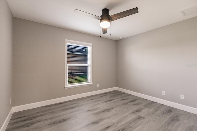 unfurnished room with ceiling fan and light wood-type flooring