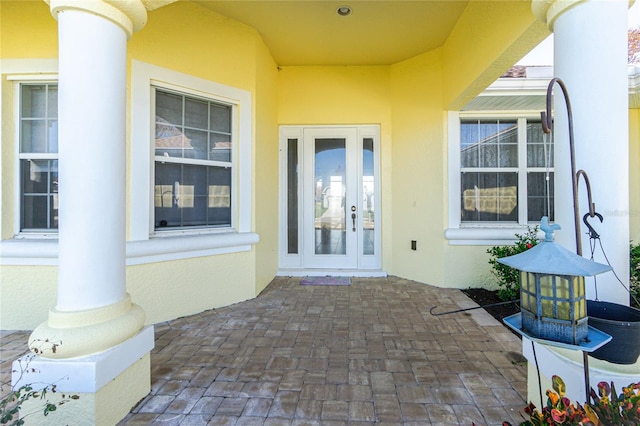 property entrance with french doors and a patio area