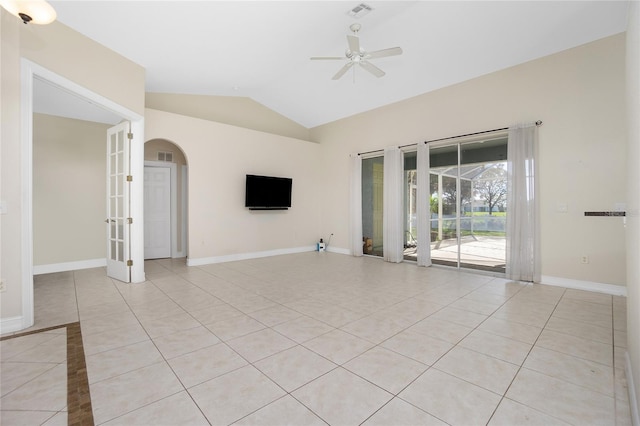 tiled empty room featuring lofted ceiling and ceiling fan