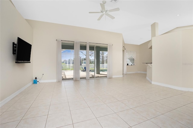 unfurnished room with lofted ceiling, light tile patterned floors, and ceiling fan