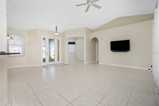 unfurnished living room with light tile patterned floors, ceiling fan, and vaulted ceiling