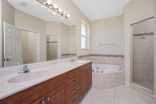 bathroom featuring vanity, tile patterned floors, and plus walk in shower