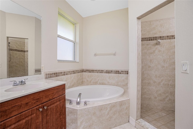 bathroom with vanity, shower with separate bathtub, and tile patterned flooring