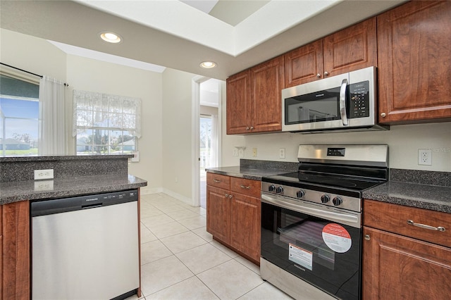 kitchen featuring appliances with stainless steel finishes and light tile patterned floors