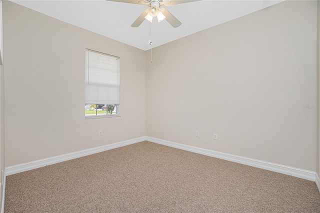 empty room featuring ceiling fan and carpet flooring