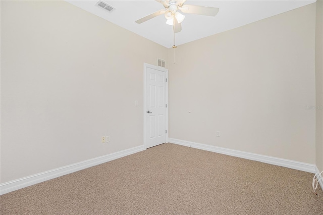 spare room featuring ceiling fan and carpet floors