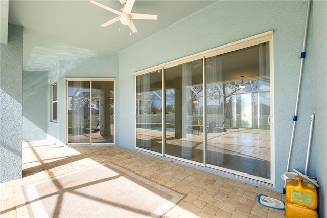 interior space featuring ceiling fan and a patio area