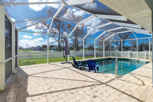 view of pool with a lanai, a yard, and a patio area