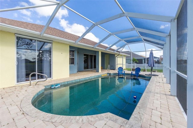 view of pool with a lanai and a patio