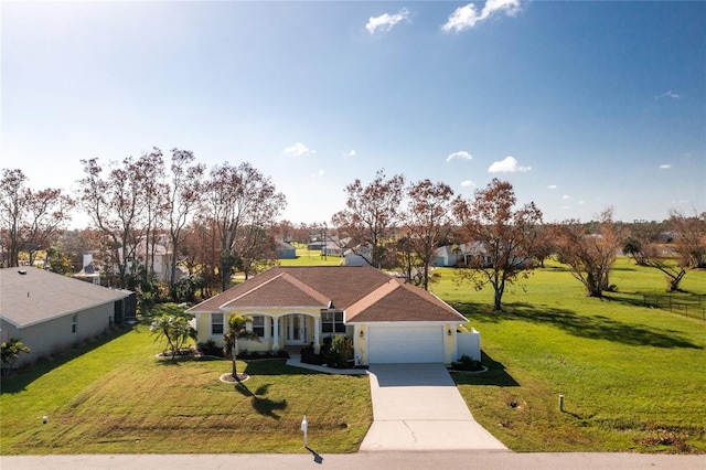 ranch-style home featuring a garage and a front lawn