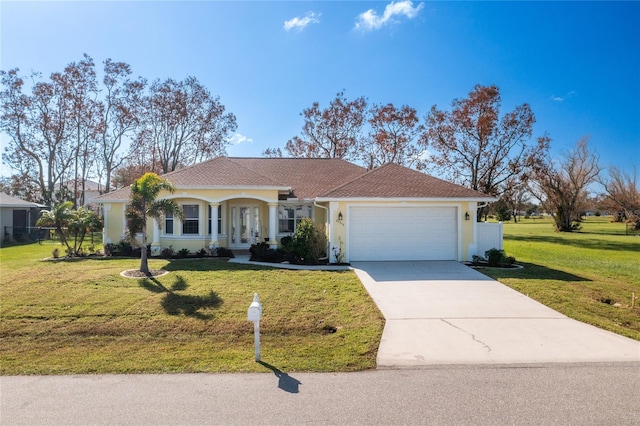 view of front of house featuring a garage and a front yard