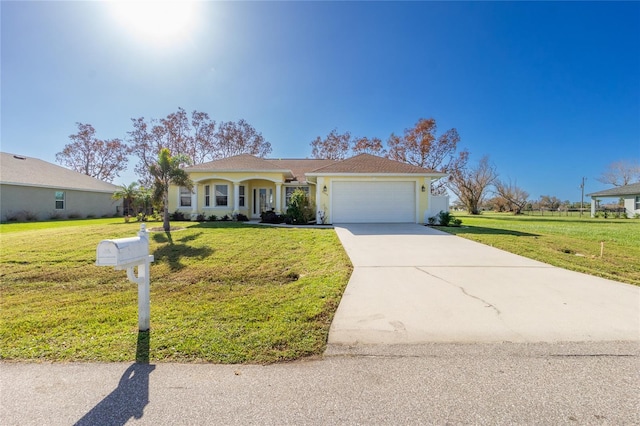 view of front of house with a garage and a front yard