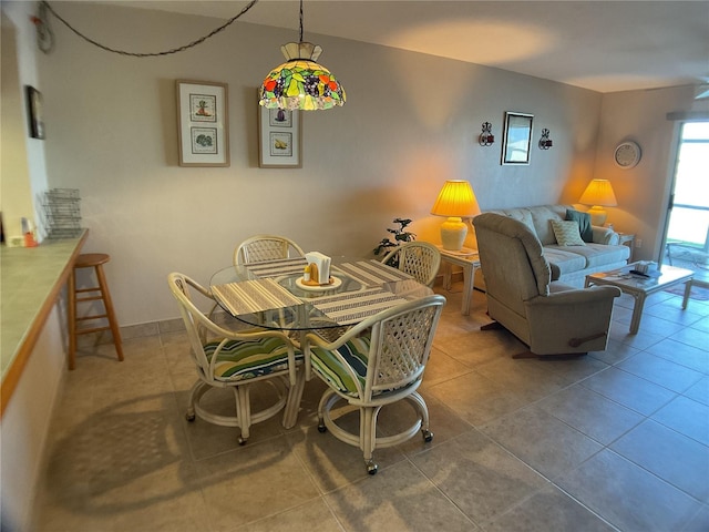 dining space with tile patterned flooring