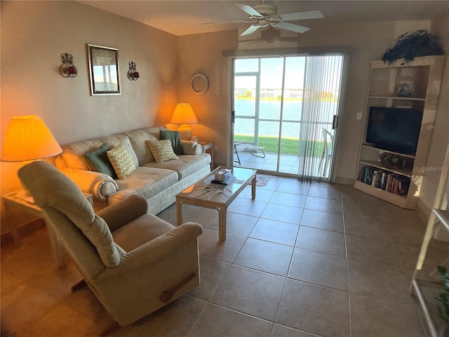 living room with ceiling fan and tile patterned floors