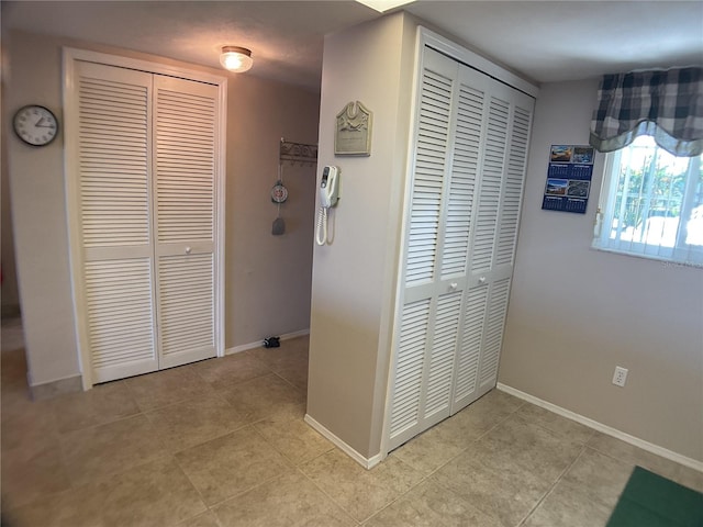 hallway featuring light tile patterned flooring