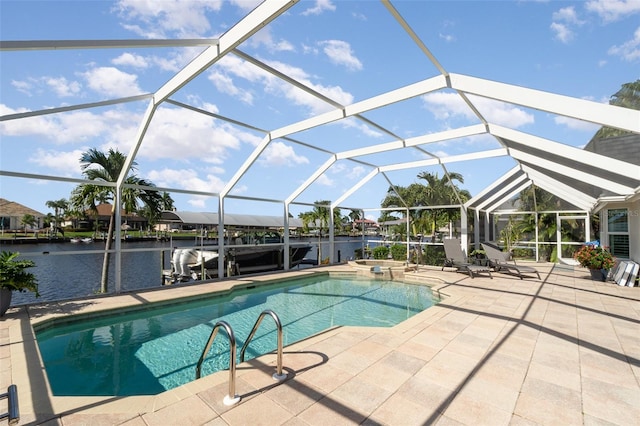 view of swimming pool featuring a patio area, a lanai, and a water view