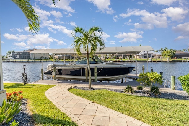 dock area featuring a yard and a water view