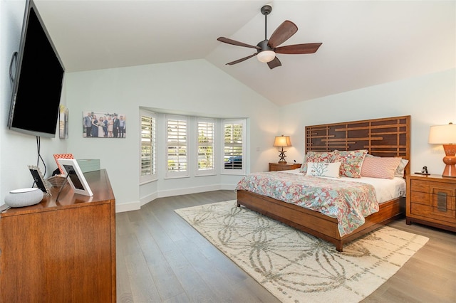 bedroom featuring vaulted ceiling, light hardwood / wood-style floors, and ceiling fan